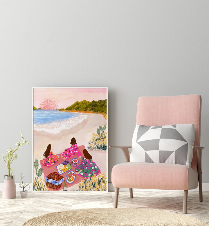 Beach Picnic By Sarah Gesek Coastal Wall Art Prints in White Plain Frame placed on the floor beside a chair