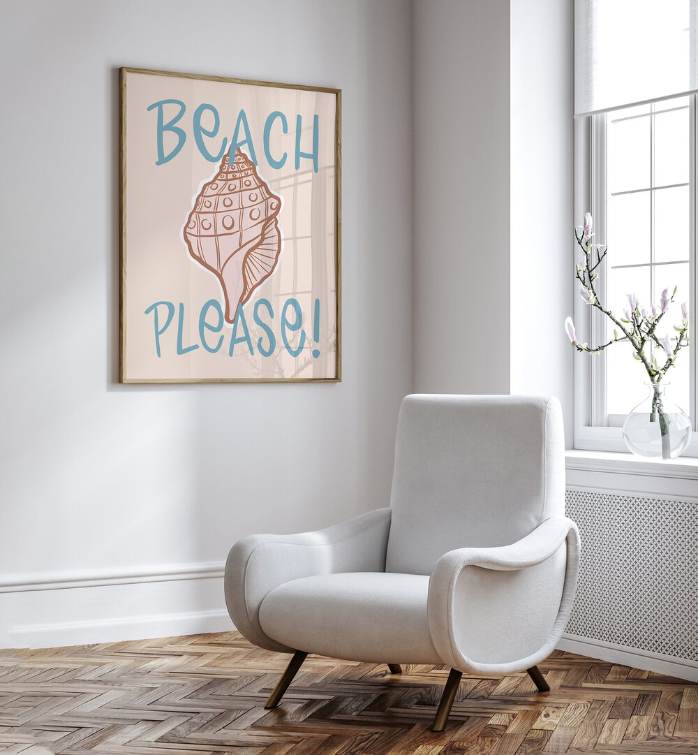 Beach Please Beach Prints Coastal Wall Art Prints in Oak Wood Plain Frame placed on a White Colored Wall near a White Sofa Chair in the Drawing Room