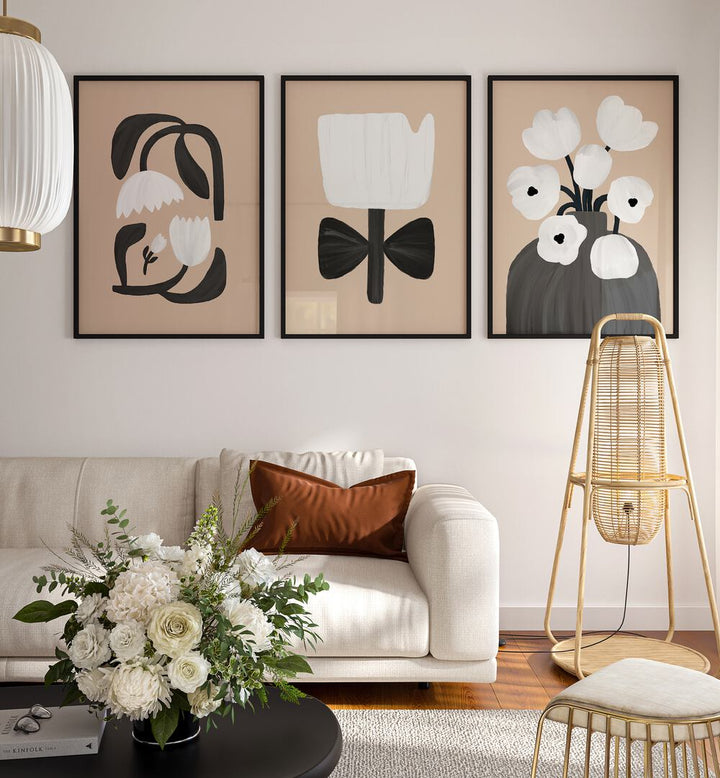 Beige Flowers Set Of 3 Paintings in Black Plain Frame placed on a wall living room wall behind a sofa