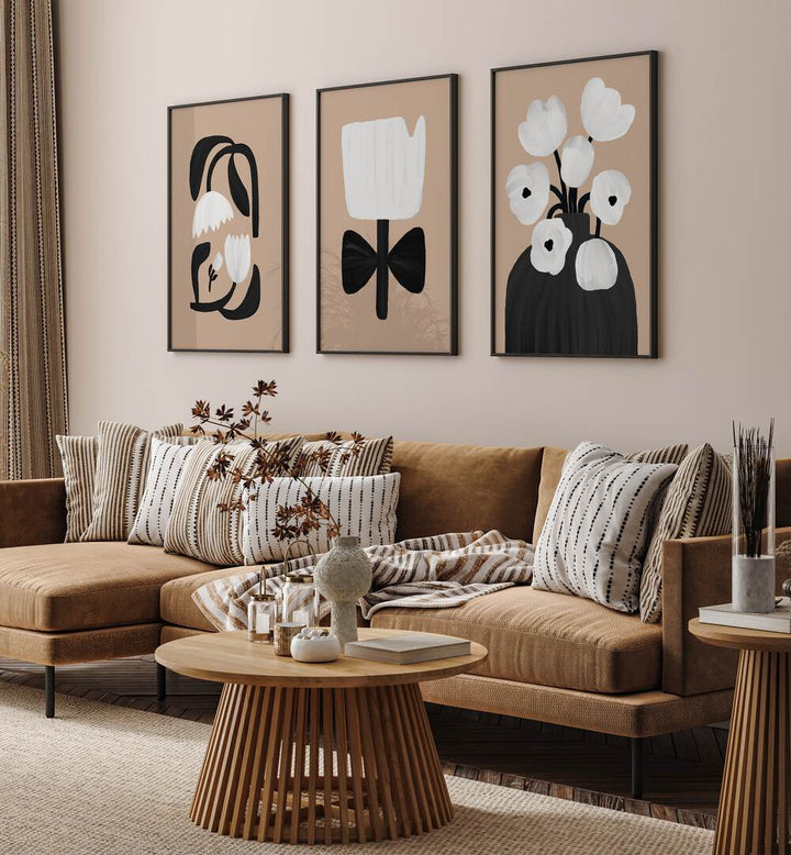 Beige Flowers Set Of 3 Paintings in Black Plain Frame placed on a wall living room wall behind a sofa