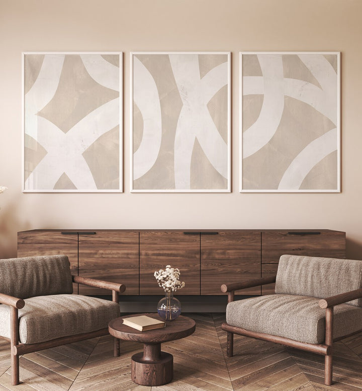 Beige Mixed Paths Set Of 3 Paintings in White Plain Frame placed on a white wall behind a console table