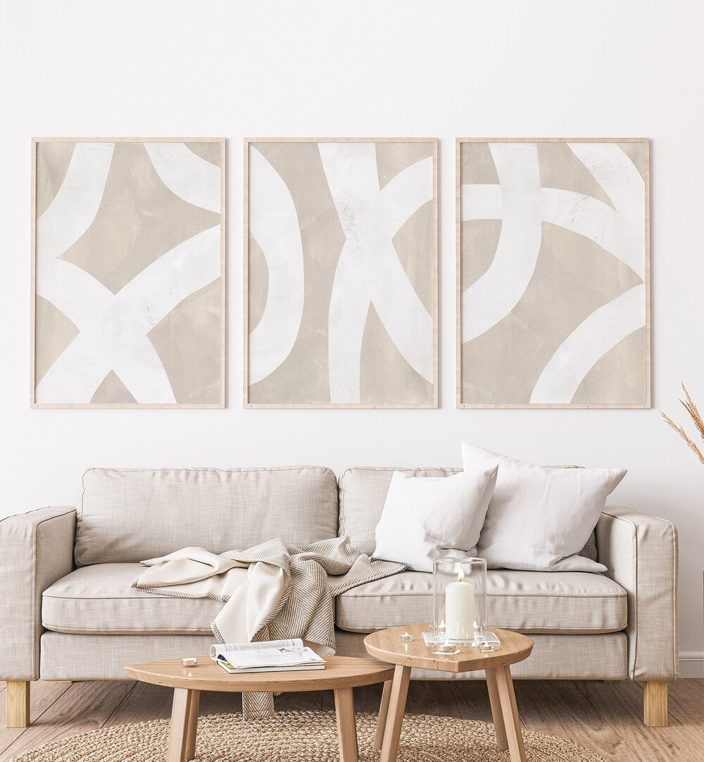 Beige Mixed Paths Set Of 3 Paintings in Oak Wood Plain Frame placed on a living room wall behind a sofa