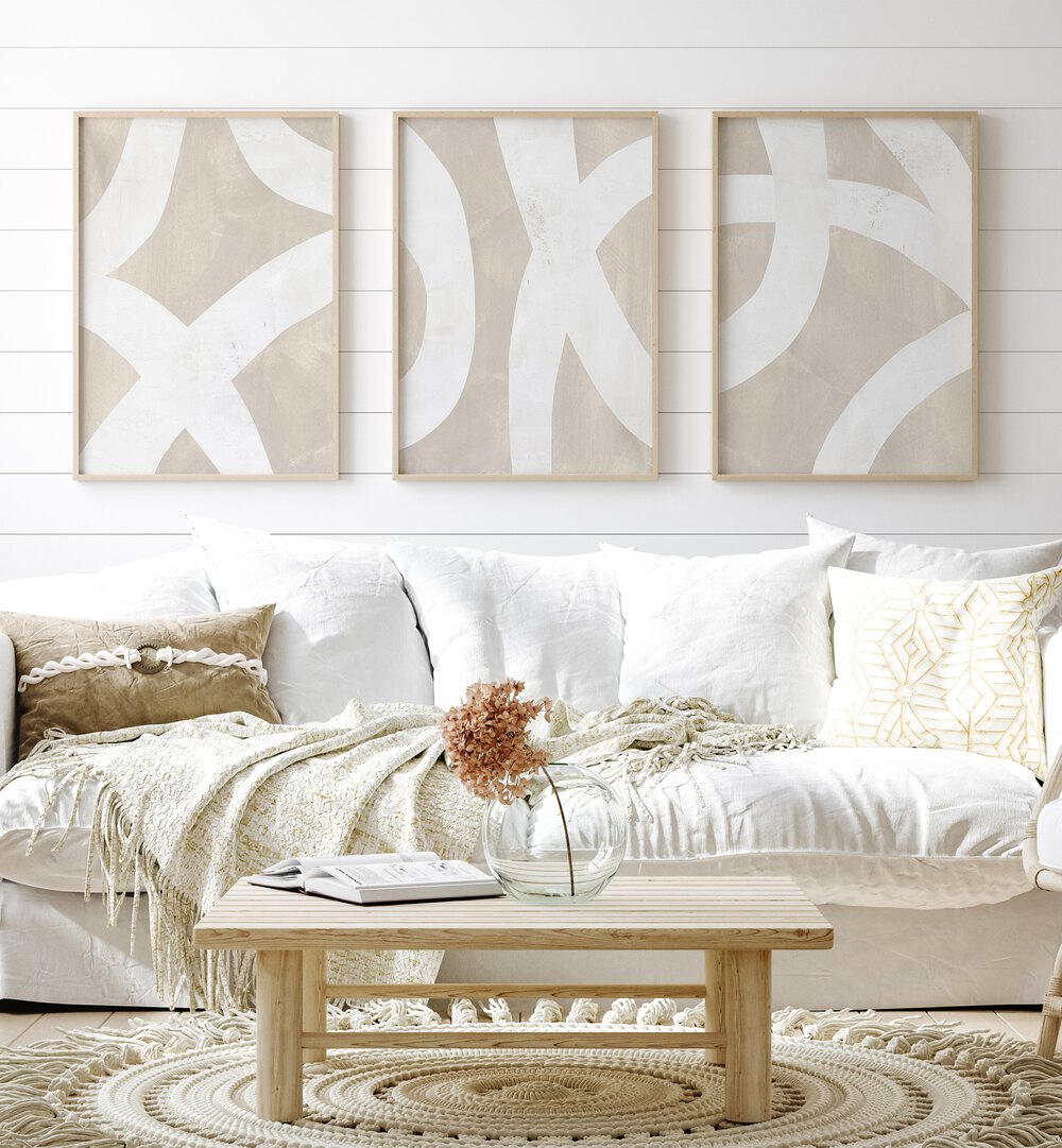 Beige Mixed Paths Set Of 3 Paintings in Oak Wood Plain Frame placed on a living room wall behind a sofa