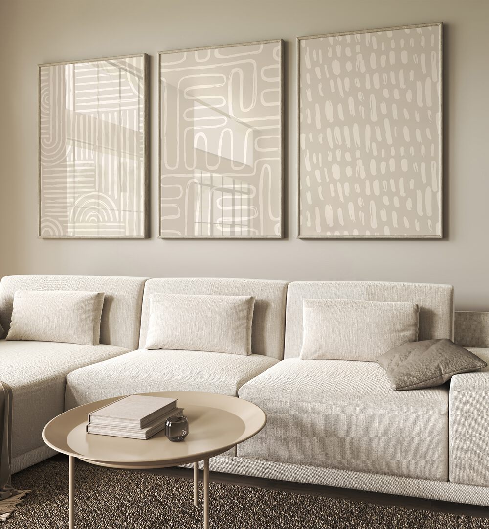 Beige Patterns Set Of 3 Paintings in Oak Wood Plain Frame placed on a beige wall behind a white sofa