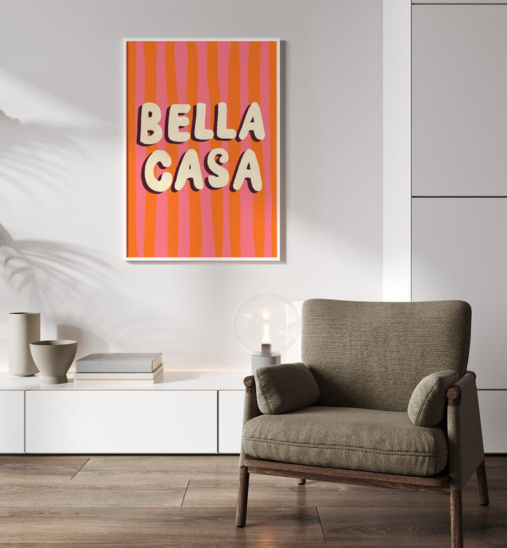 Bella Casa by Studio Dolci Quotes Art Prints in White Plain Frame placed on a wall behind a sofa