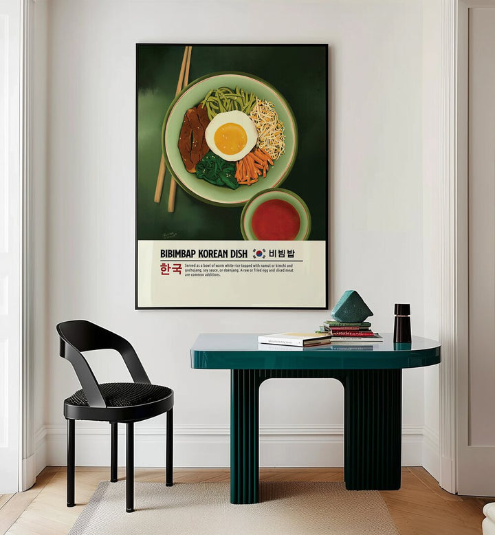 Bibimbap by Studio Mandariini Kitchen Posters Kitchen Art Prints in Black Plain Frame placed on a wall behind a study table