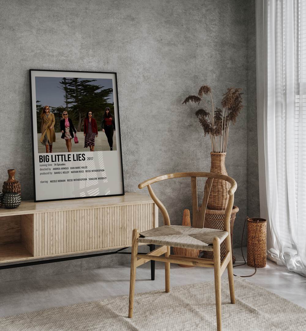 Big Little Lies 2017 Movie Posters in Black Plain Frame placed on a table beside oakwood chair