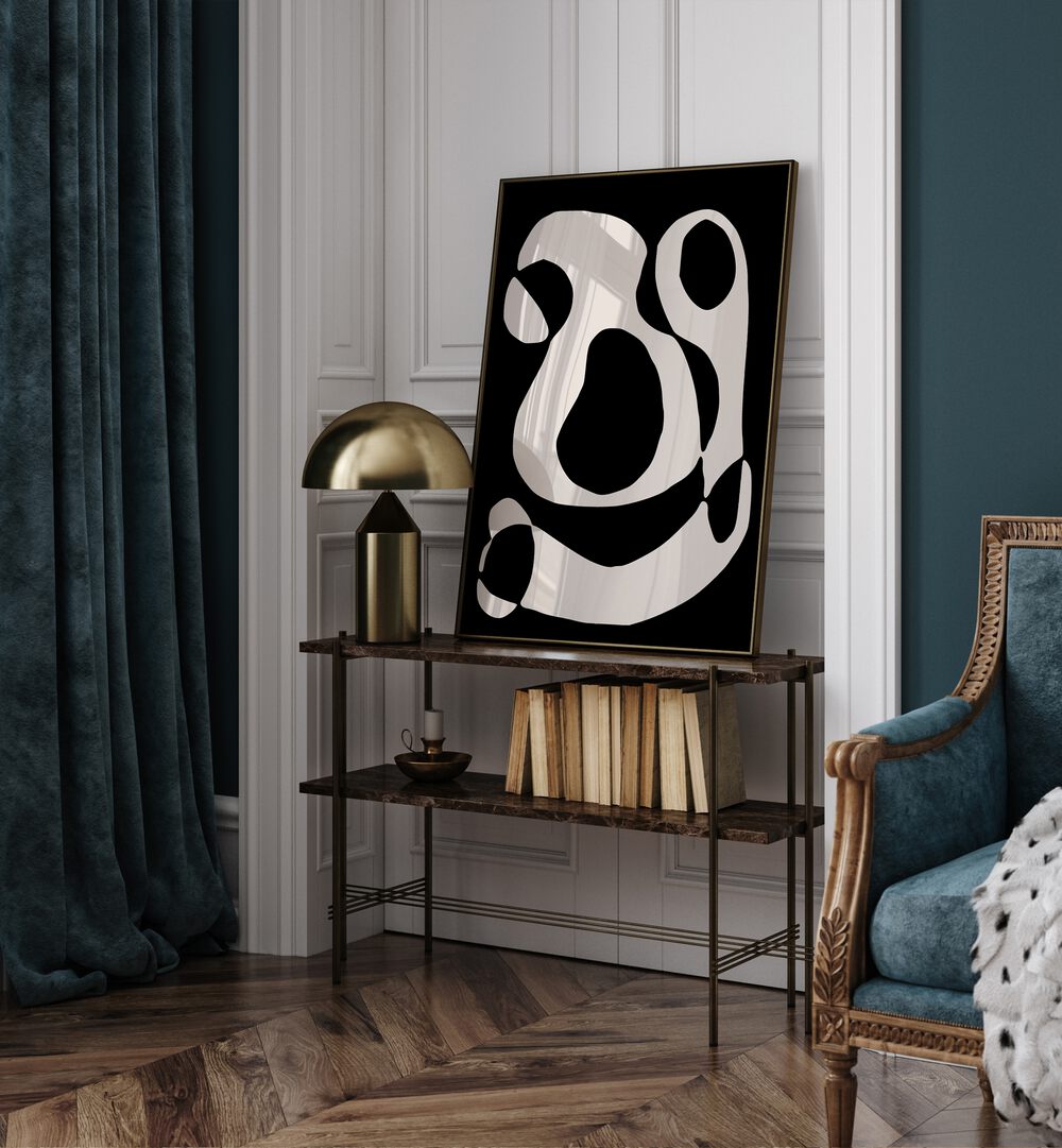 Black And Beige II By Preayna Abstract Art Paintings in Black Plain Frame above a table beside a sofa