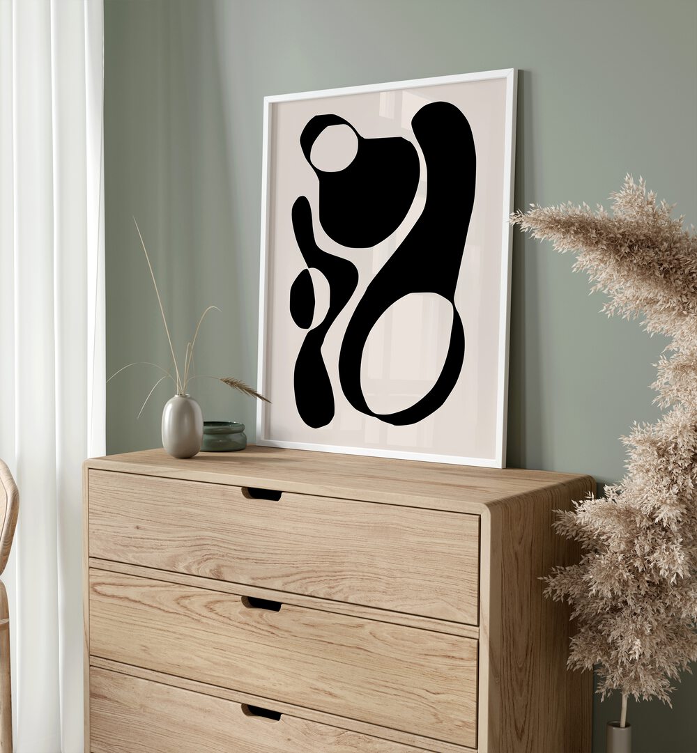 Black And Beige III By Preayna Abstract Art Paintings in White Plain Frame on a console table 