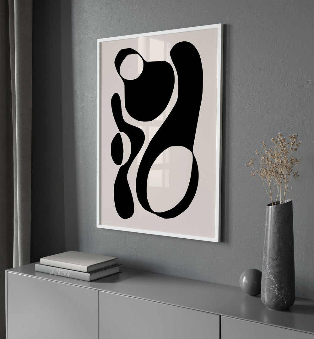 Black And Beige III By Preayna Abstract Art Paintings in White Plain Frame on a wall above a console table