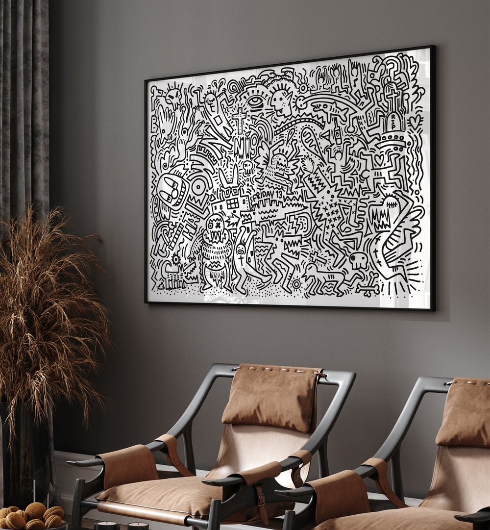 Black Doodle Set Doodle Art Paintings in Black Plain Frame placed on a wall behind two chairs