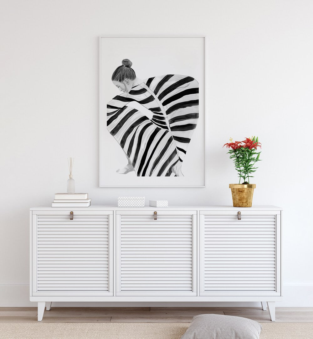 Black Moon  Women Illustrations paintings in White Plain Frame placed on a wall behind a console table