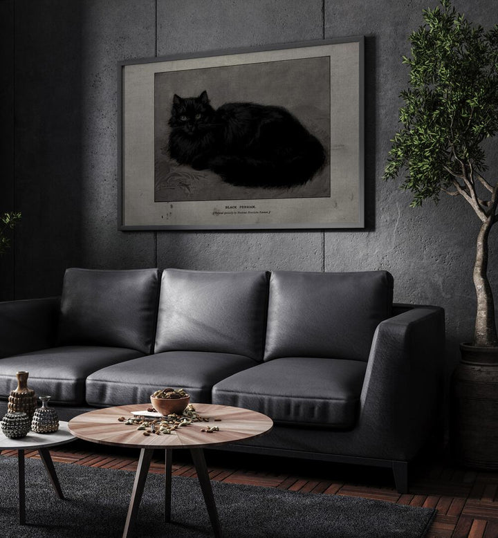 Black Persian Gothic Wall Art Prints in Black Plain Frame hanging on a wall above black leather couch beside a plant.