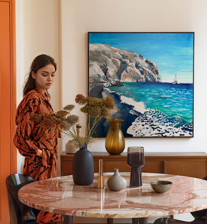 Black Sand Beach By Key And Sea Creative Landscape Artwork in Black Plain Frame behind a dining table on a white wall