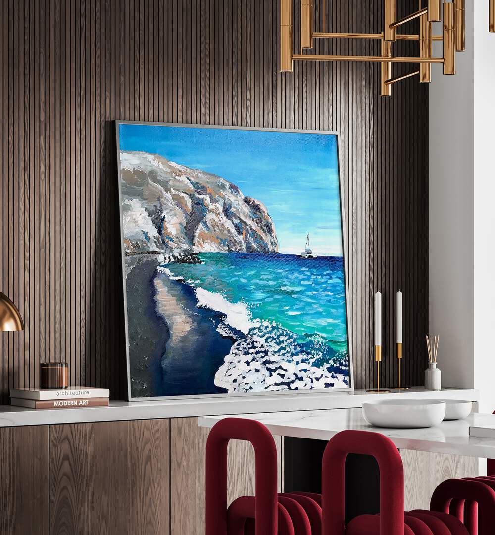 Black Sand Beach By Key And Sea Creative Landscape Artwork in Black Plain Frame on a console table behind a dining table