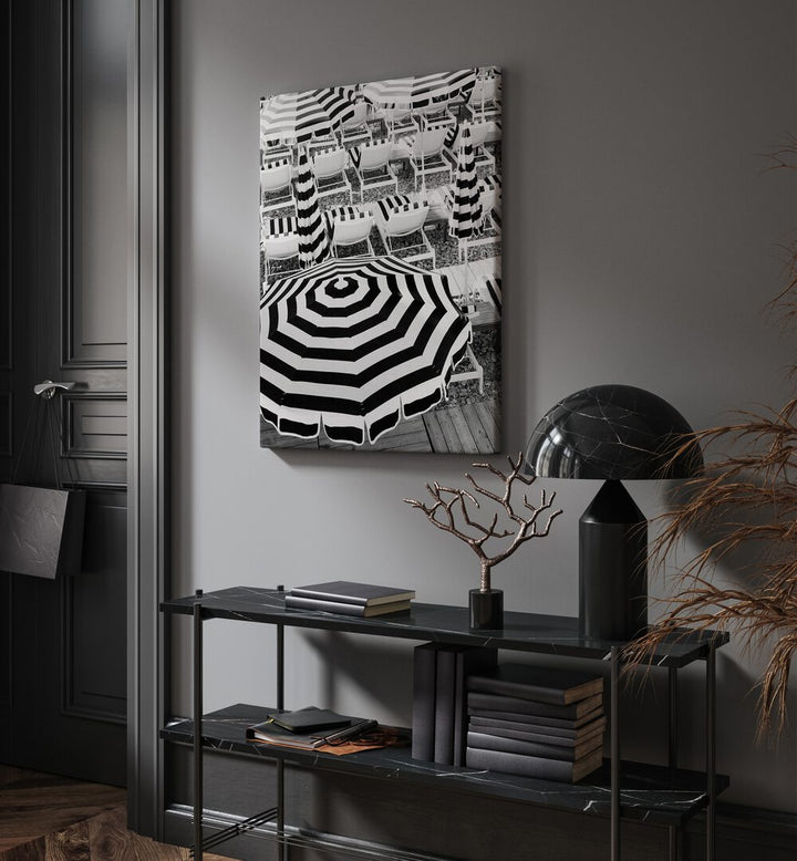 Black and White Beach Umbrellas I By Grace Digital Art Co Beach Prints in Gallery Wrap placed on a wall behind a table and beside a door