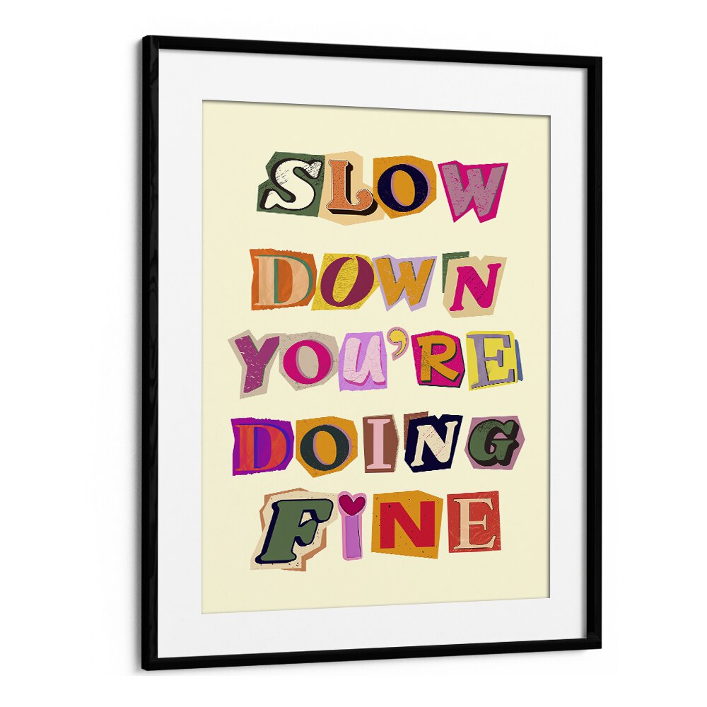 Framed artwork featuring the phrase "SLOW DOWN YOU'RE DOING FINE," perfect for any stylish space.
