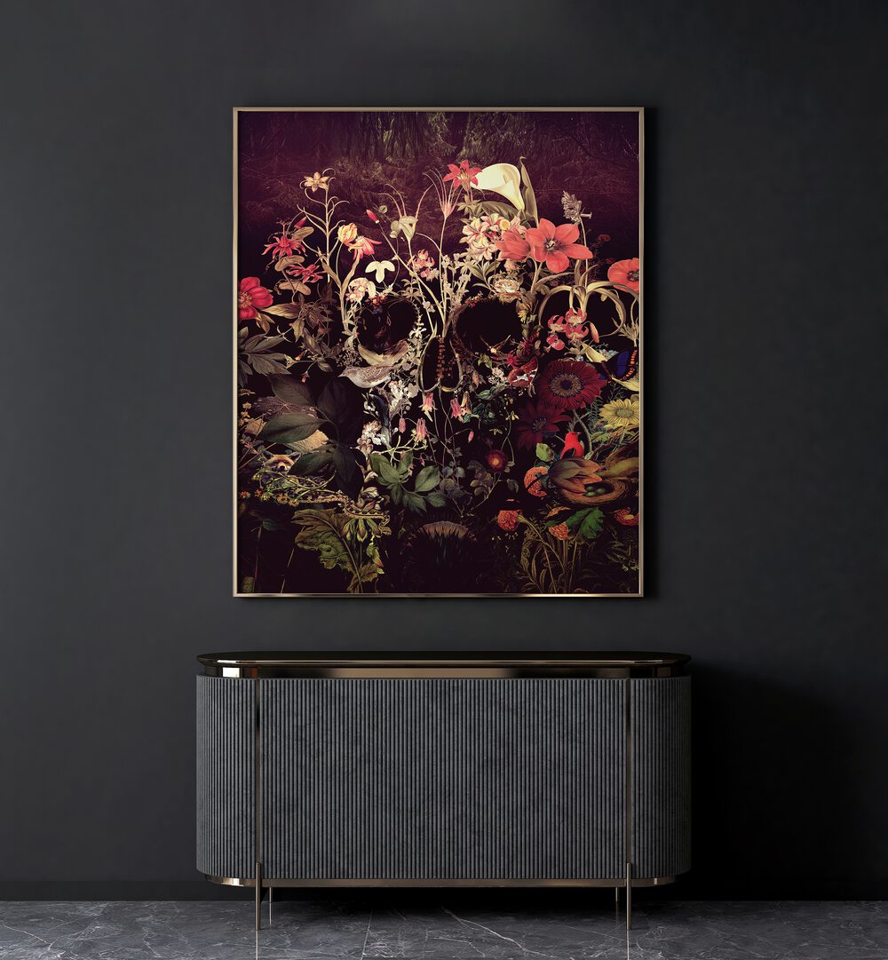 Bloom Skull Botanical Art Prints Floral Paintings in Gold Plain Frame placed on a black wall behind a table