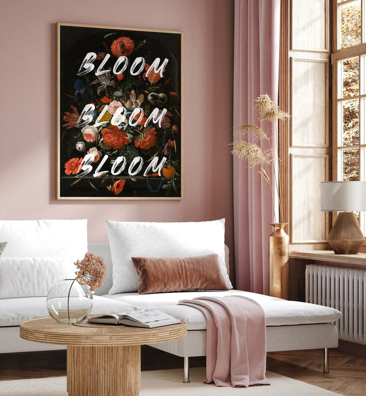 Bloom Vintage Flowers by the Art Concept Altered Art Prints in Oak Wood Plain Frame placed on a wall behind a sofa