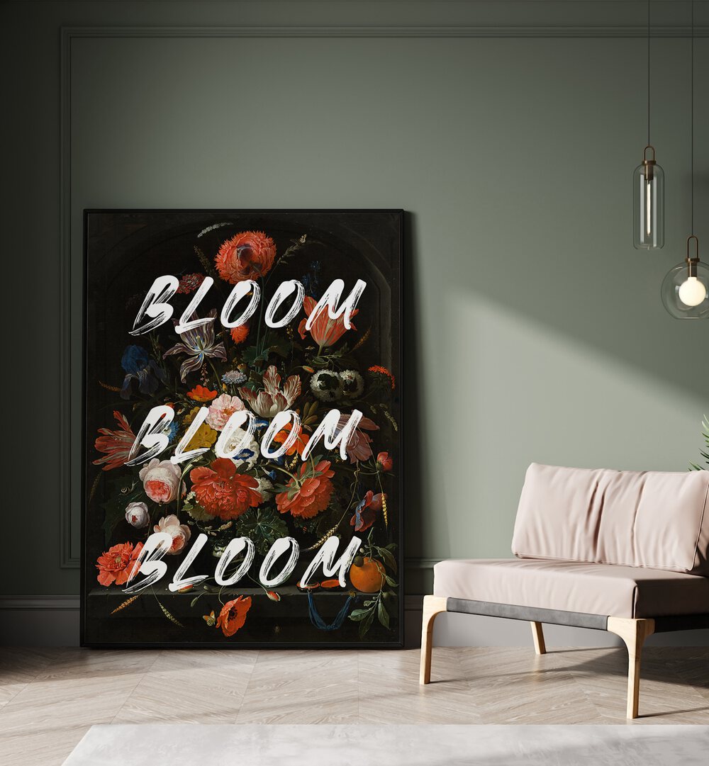 Bloom Vintage Flowers by the Art Concept Altered Art Prints in Black Plain Frame placed on the floor beside a sofa