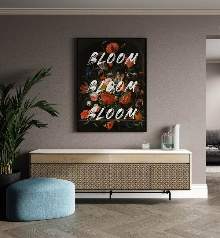 Bloom Vintage Flowers by the Art Concept Altered Art Prints in Black Plain Frame placed on a wall behind a console table