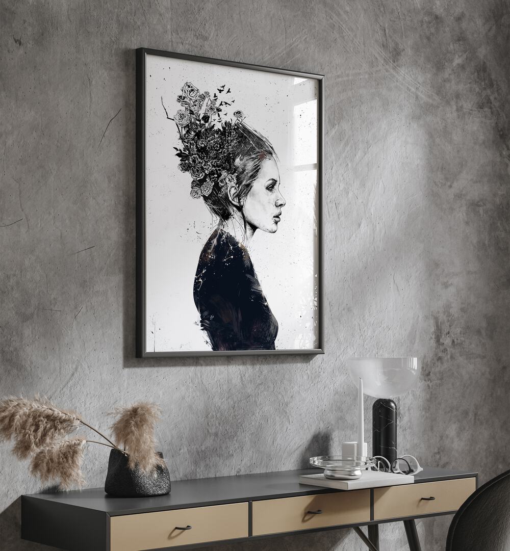 Blooming Girl By Balazs Solti Art Prints in Black Plain Frame placed on a Dark Grey Colored Wall above a Console Table in the Drawing Room