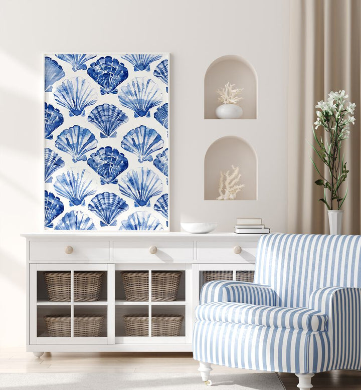 Blue Ocean Bivalve Beach Prints Coastal Wall Art in White Plain Frame placed on a table beside a sofa