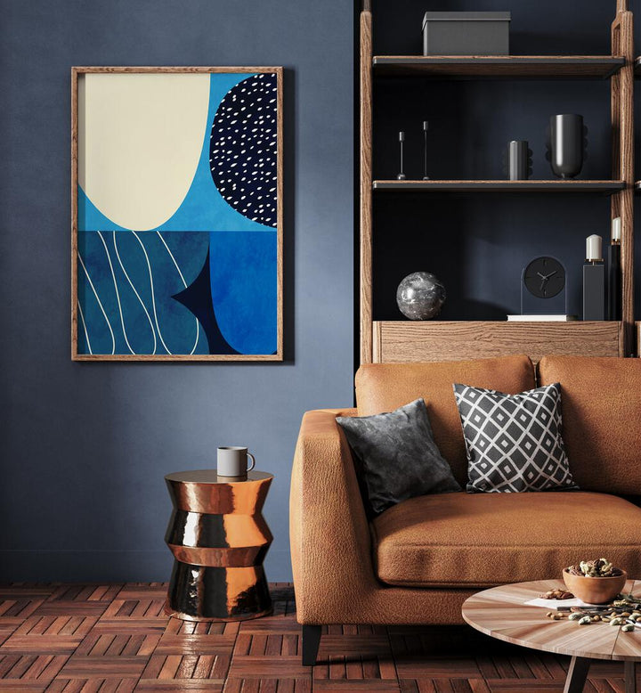 Blue Shapes Play II By Ana Rut Bre Abstract Art Abstract Wall Art in Oak Wood Plain Frame placed on a wall beside a sofa