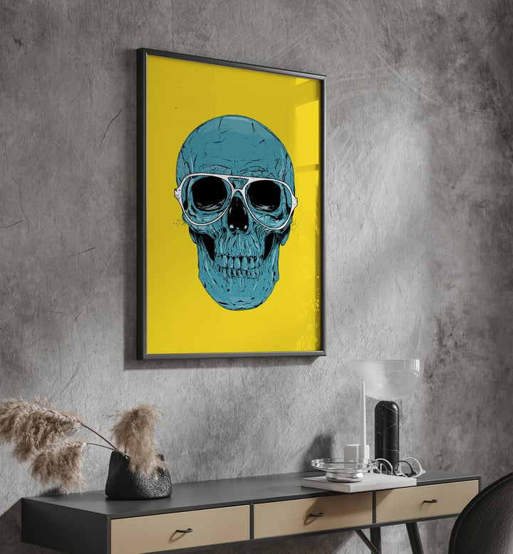 Blue Skull By Balazs Solti Art Prints in Black Plain Frame placed on a Dark Grey Colored Wall above a Console Table in the Drawing Room