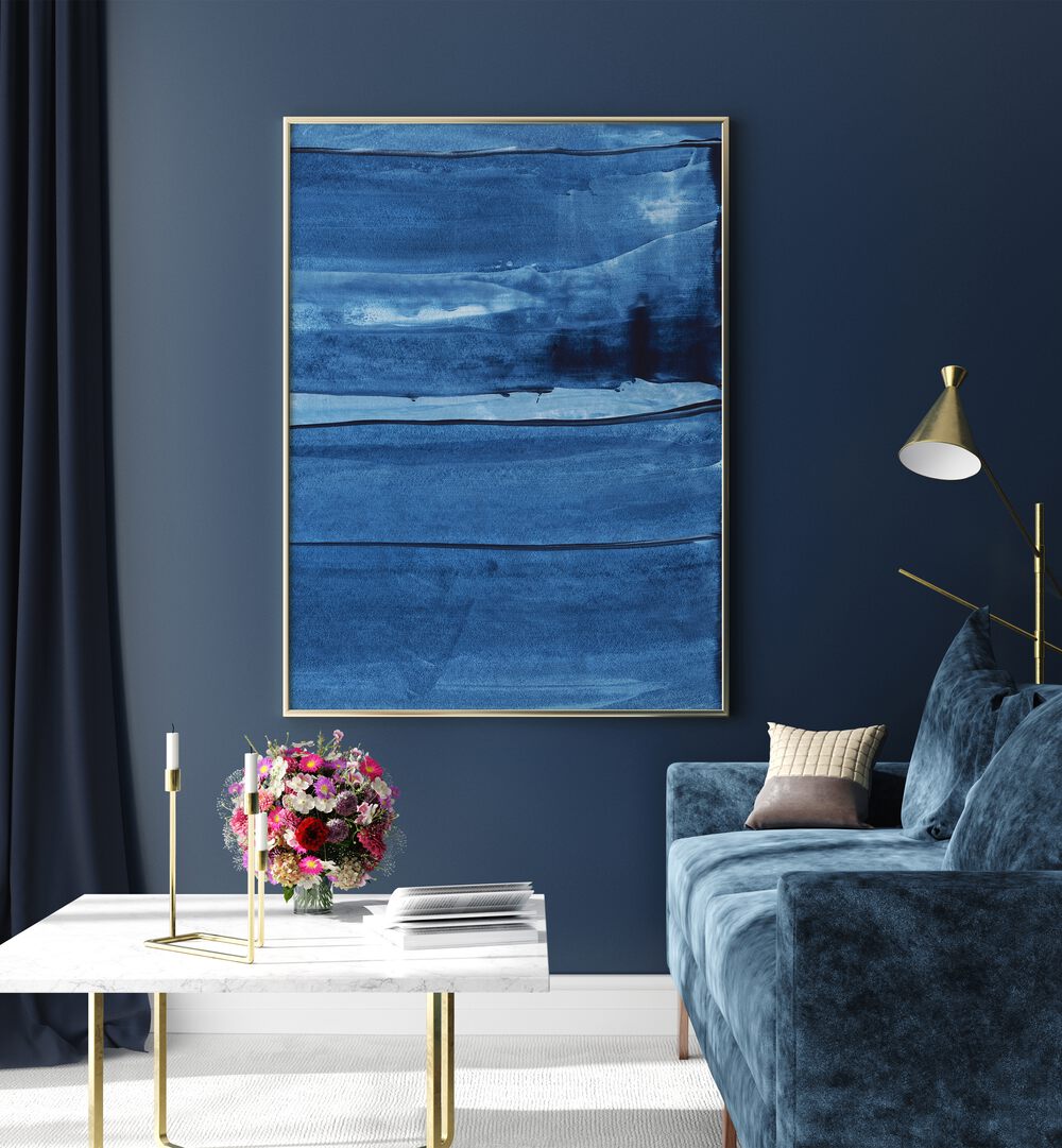 Blue Texture Vii by Uplus Me Studio Abstract Art Abstract Paintings in Oak Wood Plain Frame placed on a blue wall beside a table and a sofa