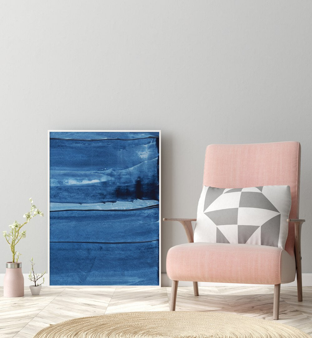 Blue Texture Vii by Uplus Me Studio Abstract Art Abstract Paintings in White Plain Frame placed on floor beside a chair