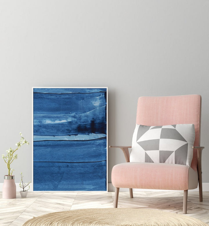 Blue Texture Vii by Uplus Me Studio Abstract Art Abstract Paintings in White Plain Frame placed on floor beside a chair