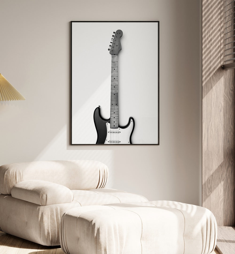 Blues Breaker Twang by David Drake Fine Art Photography Fashion Photography in Black Plain Frame placed on a wall behind a sofa