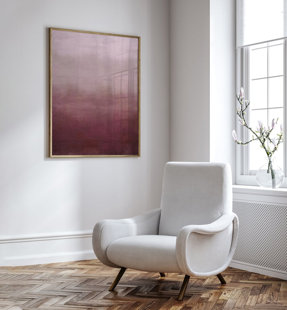 Blush Pink Abstract Abstract Art Abstract Paintings in Oak Wood Plain Frame placed on a White Colored Wall near a White Sofa Chair in the Drawing Room