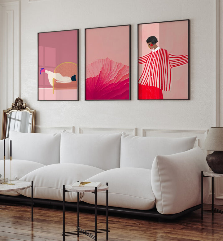 Blush Pink Set Set Of 3 Paintings in Black Plain Frame placed on a wall living room wall behind a sofa