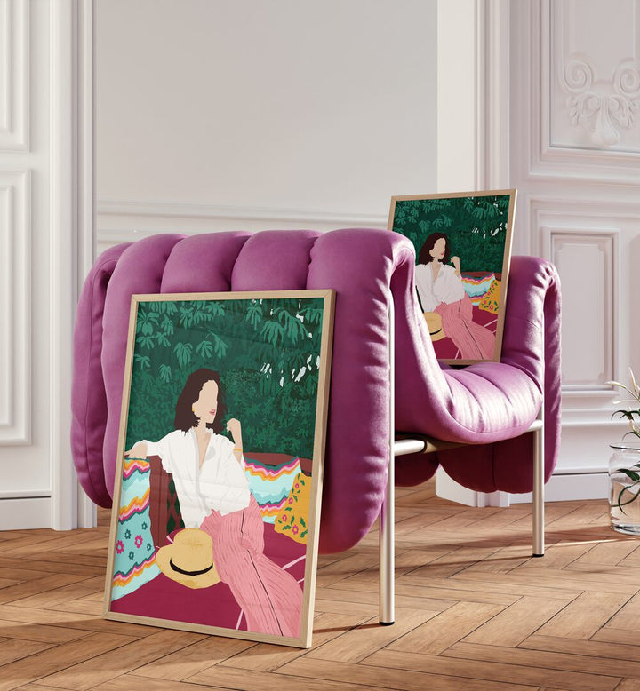 Bohemian Soul By Uma Gokhale Woman Illustration Paintings in Oak Wood Plain Frame on a floor beside a pink sofa and on a pink sofa