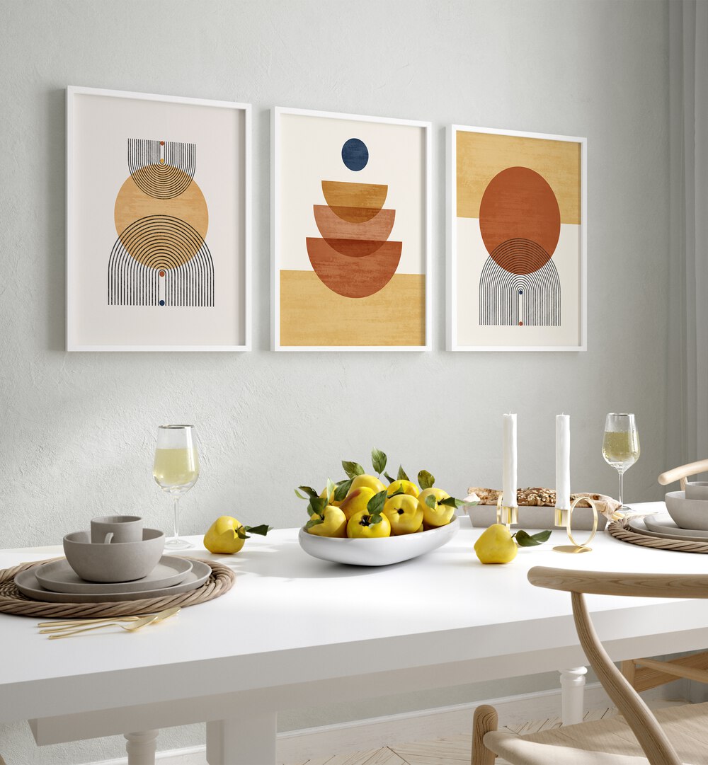 Boho Geometrical Awakenings Set Of 3 Paintings in White Plain Frame placed on a wall behind a dining table  for dining area