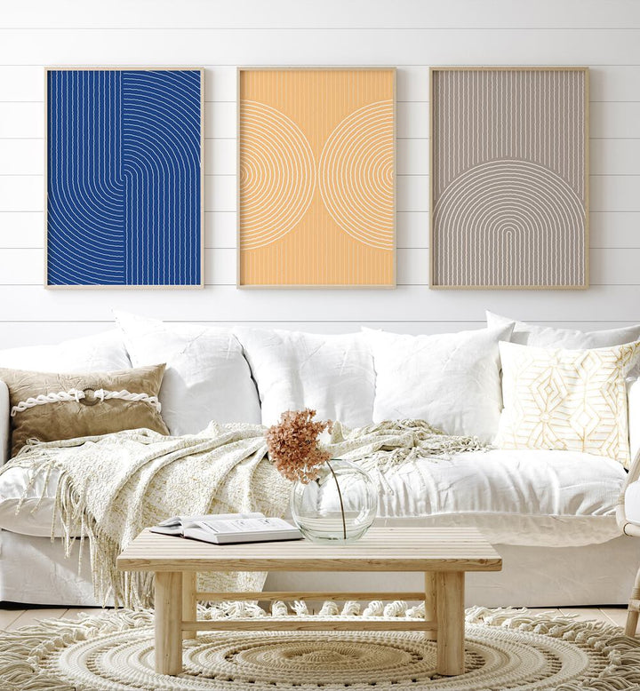 Boho Patterns In Pastel Colors Set Set Of 3 Paintings in Oak Wood Plain Frame placed on a white wall behind a white sofa for living room