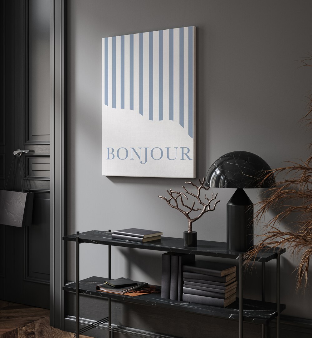 Bonjour By Grace Digital Art Co Quotes And Typography in Gallery Wrap placed on a wall behind a black table and beside a door