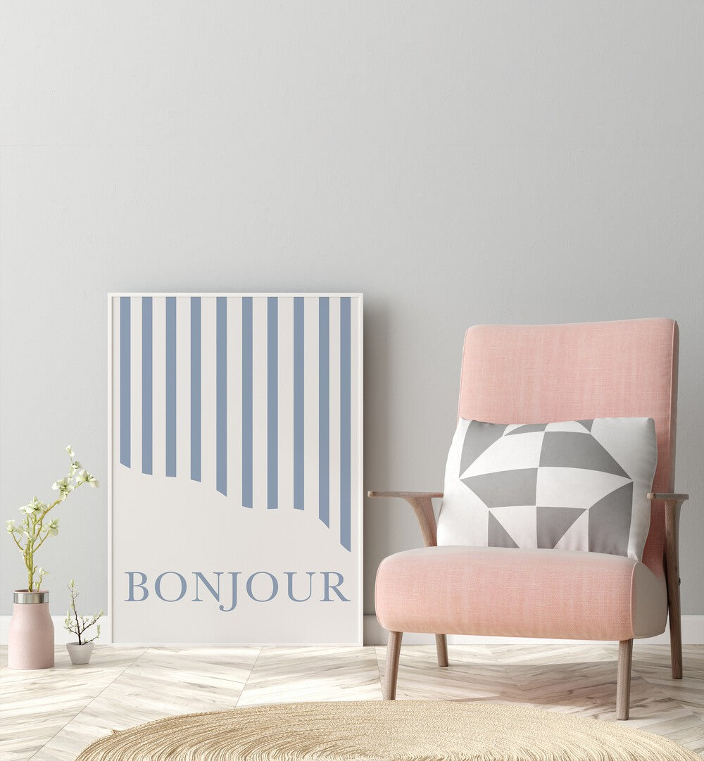 Bonjour By Grace Digital Art Co Quotes And Typography in White Plain Frame placed on a floor beside a chair