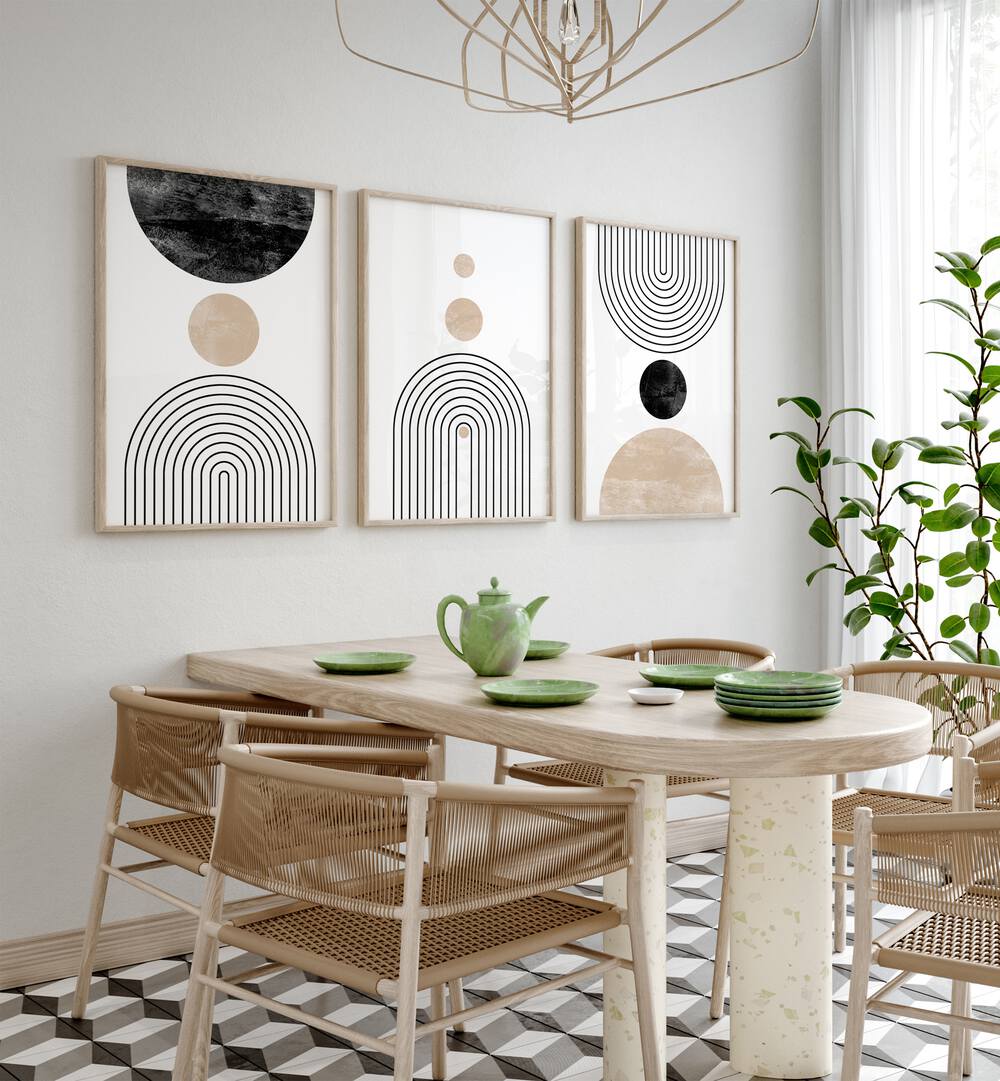 Boon Boho Lines Set Of 3 Paintings in Oak Wood Plain Frame placed on a wall behind a dining table and beside a window for dining area