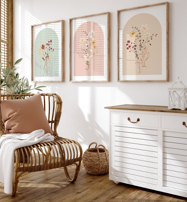 Botanica Set Set Of 3 Paintings in Oak Wood Plain Frame placed on a wall beside a chair and a console table