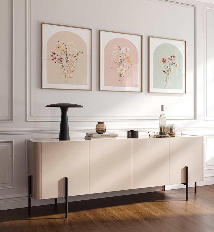 Botanica Set Set Of 3 Paintings in Oak Wood Plain Frame placed on a wall behind a console table