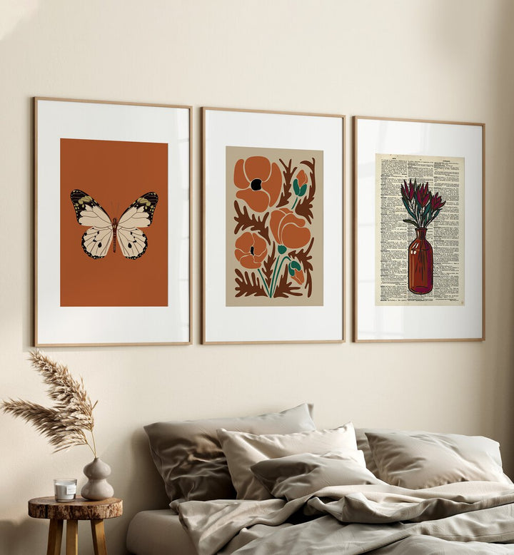 Botanical Set Set Of 3 Paintings in Oak Wood Frame With Mount placed on a wall behind a bed in a bedroom