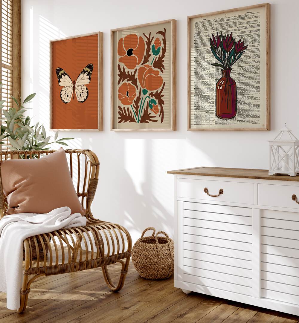 Botanical Set Set Of 3 Paintings in Oak Wood Plain Frame placed beside a chair and a console table