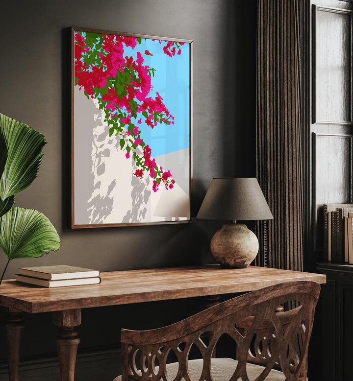 Bougainvillea Blossom By Uma Gokhale Botanical Art Prints in Dark wood frame above a study table on a wall beside a plant