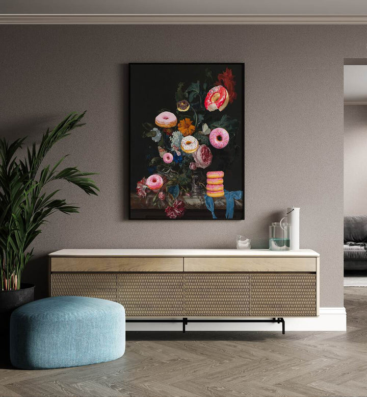 Bouquet of Donuts by the Art Concept Altered Art Prints in Black Plain Frame placed on a wall behind a console table