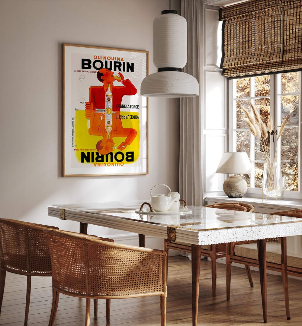 Bourin Cafe Art Prints Cafe Posters in Oak Wood Plain Frame placed on a wall in a dining room area beside a window and behind a dining table