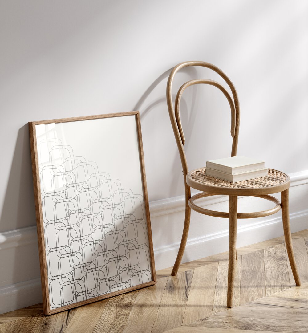 Box In Box By Grishma Korjani Line Art Prints in Oak Wood Plain Frame placed on a Floor near a Cream Colored Wall