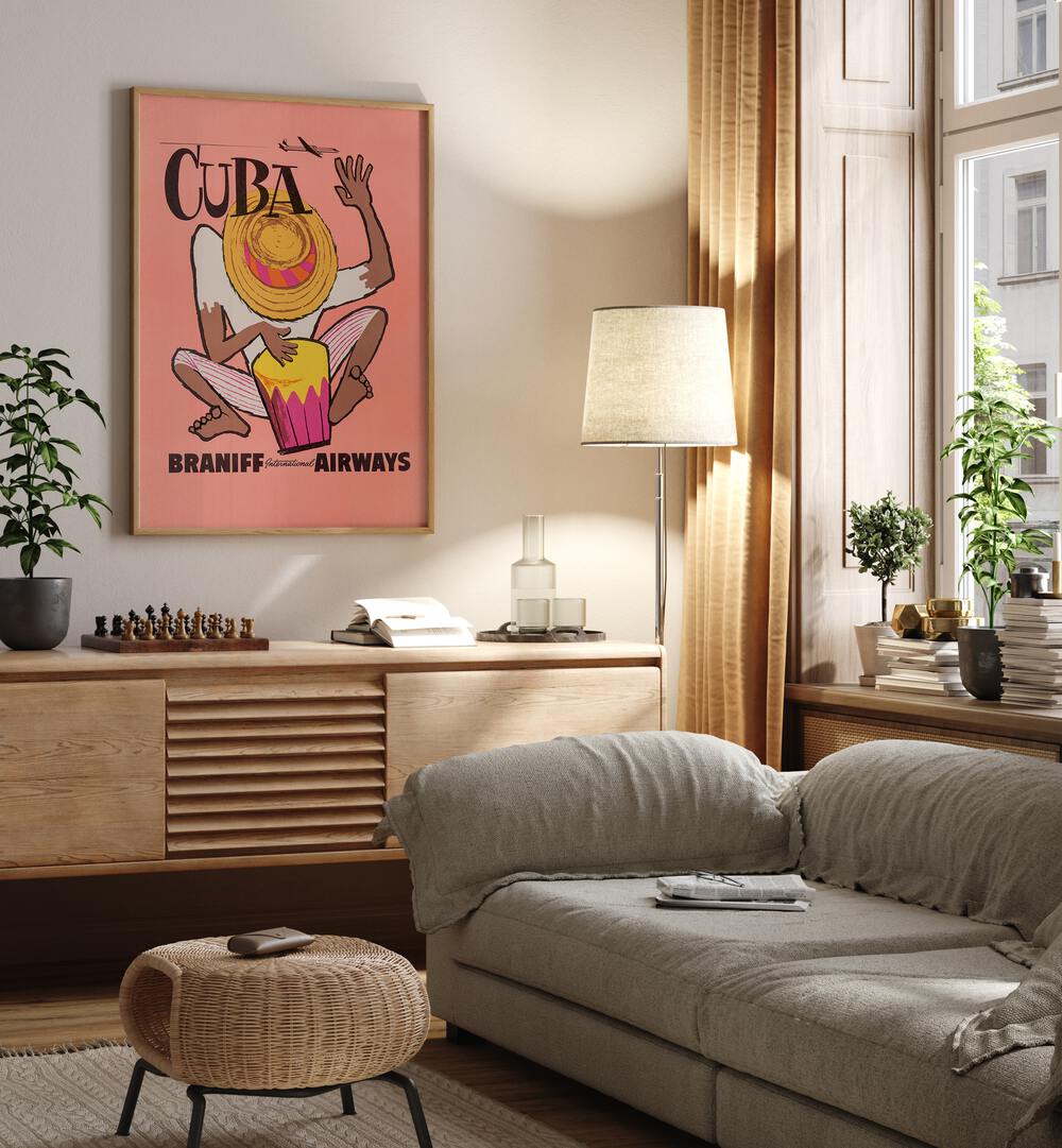 Braniff Airways-cuba  Retro Travel Posters in Oak Wood Plain Frame placed on a wall behind a console table 